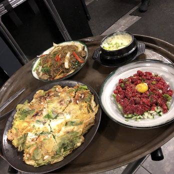 Wooga - Hae Mul Paj Jun (seafood pancake), Jap Che (rice noodles), and the delectable Yook Hwe (steak tartar). - Korean Near Me - Fort Lee, New Jersey Wooga - Hae Mul Paj Jun (seafood pancake), Jap Che (rice noodles), and the delectable Yook Hwe (steak tartar). - Korean Near Me - Fort Lee, New Jersey