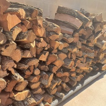 Killen's Barbecue - Logs outside used to cook meats - Barbeque Near Me - Pearland, Texas Killen's Barbecue - Logs outside used to cook meats - Barbeque Near Me - Pearland, Texas