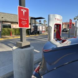Tesla Supercharger - Several chargers on site. All occupied so we still had to wait at least 15 minutes for our turn.