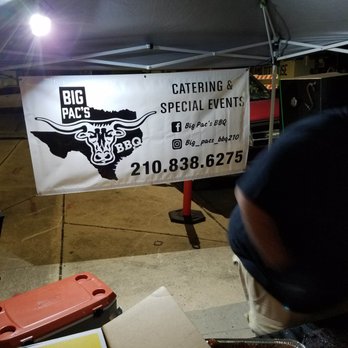 Big Pac's BBQ - a man preparing food under a tent - Food Trucks Near Me - San Antonio, Texas