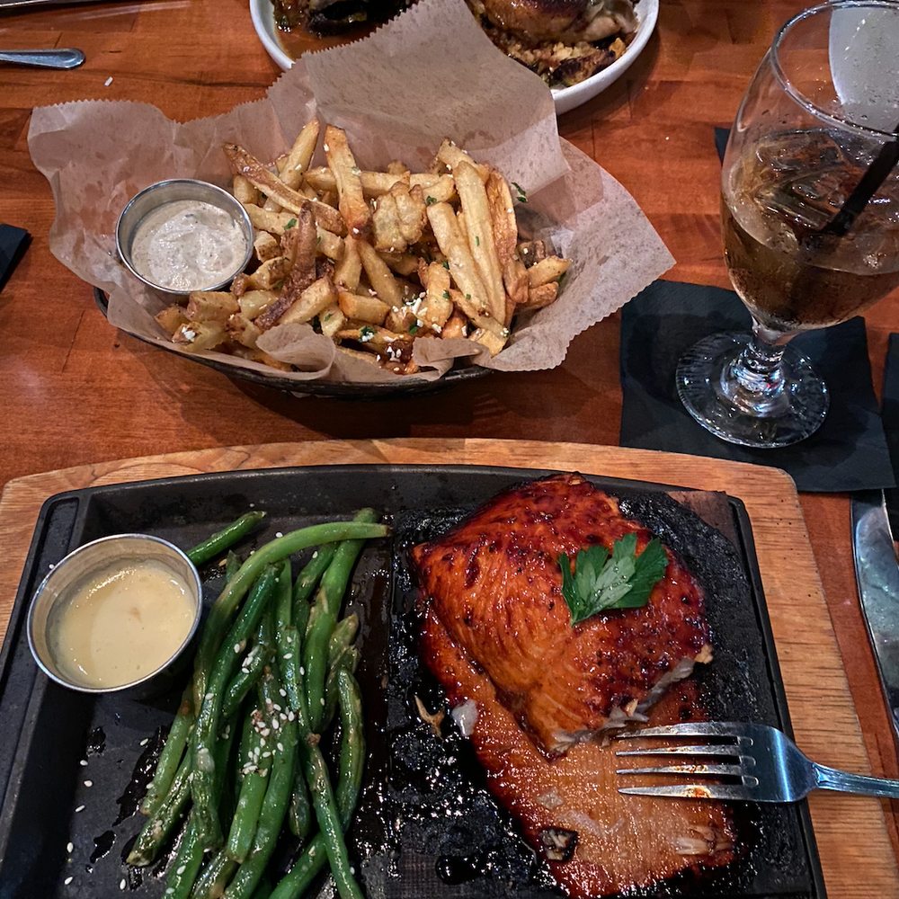 Roaring Fork - teriyaki salmon with green beans, truffle fries and rotisserie chicken - New American Near Me - Austin, Texas