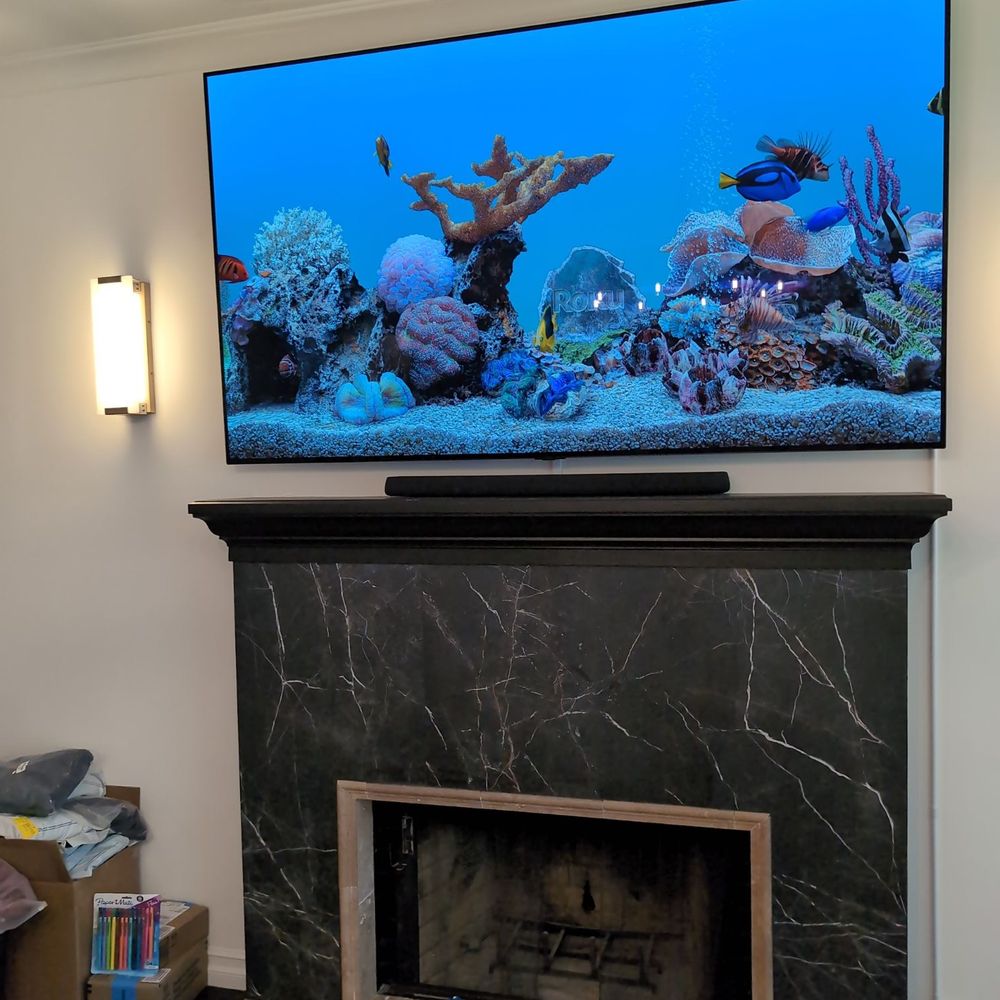 Modtech Design - Gaston put up a very large, delicate 85" OLED TV. - Home Theatre Installation Near Me