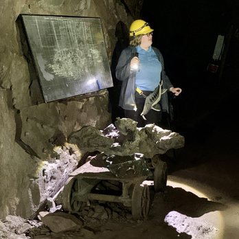 Quincy Mine Tours - Our guide, Cam, showing us some copper in the mine. - Tours Near Me - Hancock, Michigan