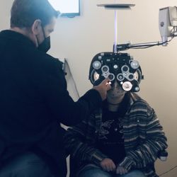 Granite Bay Vision Care - Dr. Lockhart is fine-tuning a patient's corrective lenses using his state-of-the-art equipment.