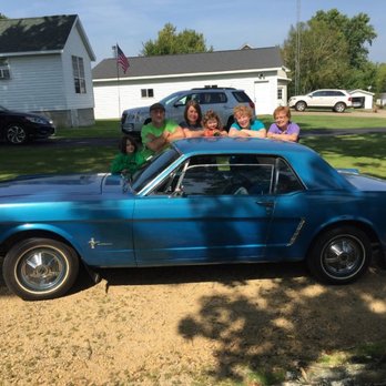 Louisburg Junction - a group of people posing in front of a blue mustang - Supper Clubs Near Me - Cuba City, Wisconsin Louisburg Junction - a group of people posing in front of a blue mustang - Supper Clubs Near Me - Cuba City, Wisconsin