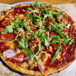 11" meat eater pizza with roasted garlic, bell peppers, and arugula added 11" meat eater pizza with roasted garlic, bell peppers, and arugula added