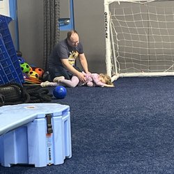 My husband calming my daughter who fled to the corner