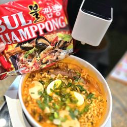 Slurp & Sip - JJAMPPONG! spicy seafood soup with ramen, egg, sausage, green onion & cilantro.