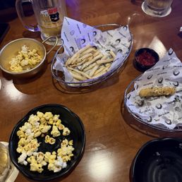 Free pop corn. $6.99 fries and $14.99 frozen calamari that's been refried.