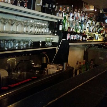 Legends Food & Spirits - a bar filled with liquor - Lounges Near Me - New Orleans, Louisiana