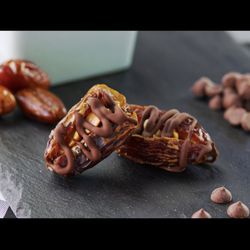 Gina’s Vegan A Go Go - Snicker Date Bites - Dates stuffed with natural peanut butter, peanuts and topped with vegan chocolate