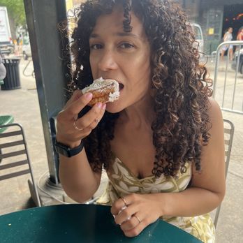 Loretta's Authentic Pralines - Brittney enjoying her beignet - Candy Stores Near Me - New Orleans, Louisiana
