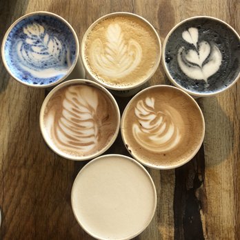Soul Grind Coffee Roasters - Drinks for 6: from top, L to R.. Blue matcha, cliffside, charcoal, hot chocolate, mocha and chai lattes - Coffee & Tea Near Me - Pacifica, California Soul Grind Coffee Roasters - Drinks for 6: from top, L to R.. Blue matcha, cliffside, charcoal, hot chocolate, mocha and chai lattes - Coffee & Tea Near Me - Pacifica, California