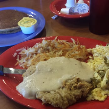 Pancake House - Chicken fried steak, scrambled eggs with onions and jalapeños, hash potatoes and a red velvet pancake - Breakfast & Brunch Near Me - Lubbock, Texas