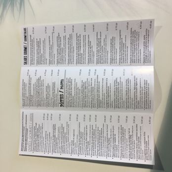 Bravo Bistro Grill & Traiteur - a close up of a menu on a table - Bistros Near Me - Laval, Quebec