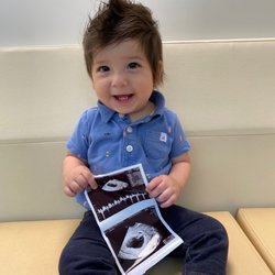 Columbia University Fertility Center - My first successful transfer holding a picture of my second