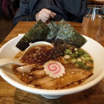 Ippudo Berkeley - shoyu ramen. what are those things floating in the broth - pork fat or tempura batter? - Ramen Near Me - Berkeley, California