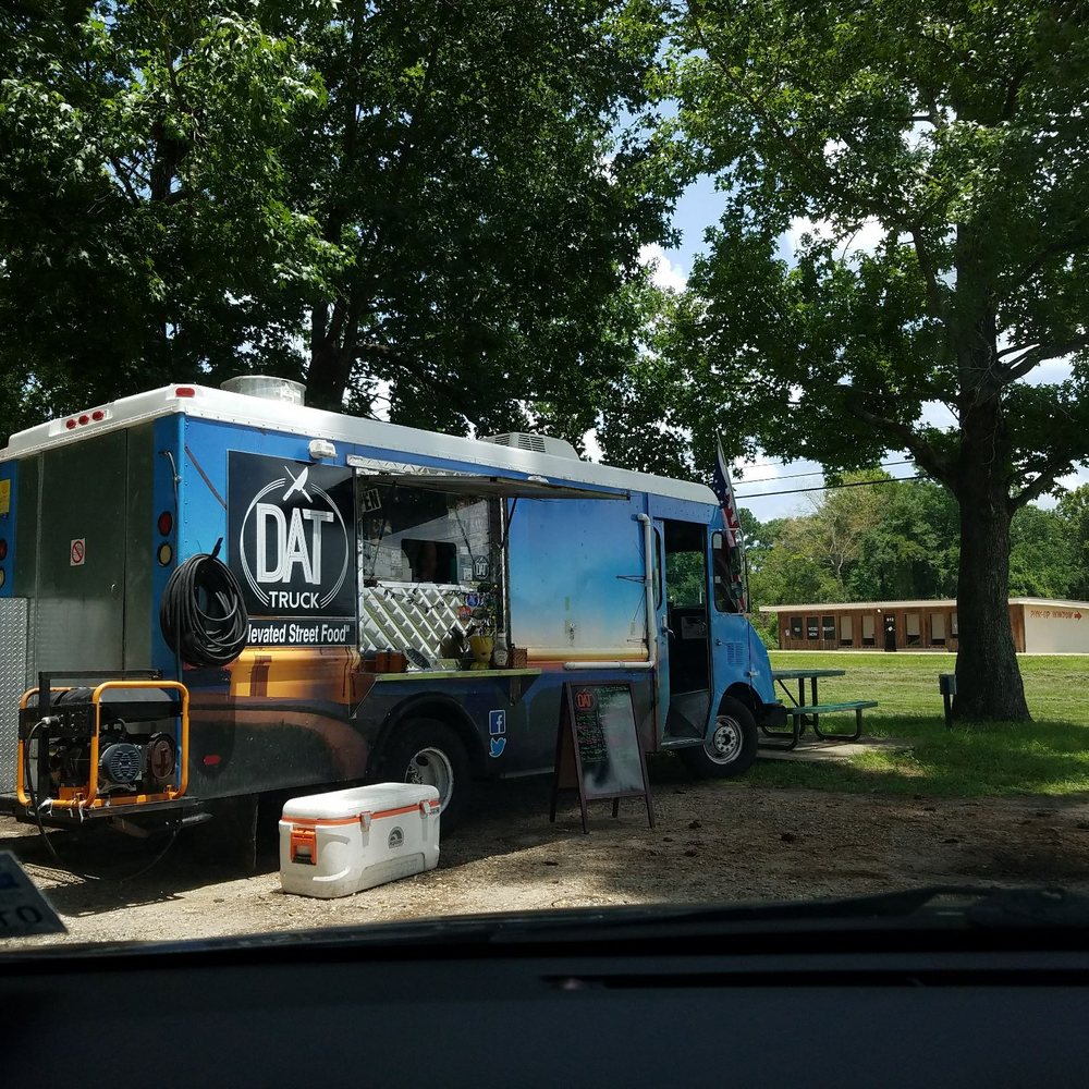 Dat Truck - a truck parked in a park - Food Trucks Near Me Dat Truck - a truck parked in a park - Food Trucks Near Me