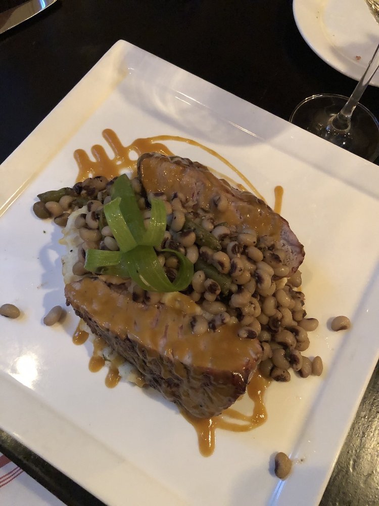 Pork chops with black eyed peas and jalapeño grits Yelp