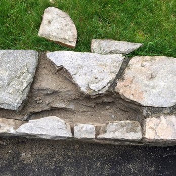 HJ Landscaping - a stone wall with grass in the background - Masonry/Concrete Near Me - Darien, Connecticut HJ Landscaping - a stone wall with grass in the background - Masonry/Concrete Near Me - Darien, Connecticut