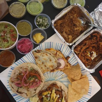 La Capital Tacos - Takeout with carnitas and al pastor tacos, two quesadilla and guac w/ chips. So good! - Mexican Near Me - Montreal, Quebec