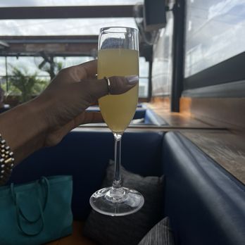 STIRR - Pineapple Orange Mimosa - Cocktail Bars Near Me - Dallas, Texas