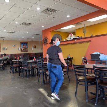 La Tapatia - a woman wearing a face mask in a restaurant - Mexican Near Me - Leander, Texas La Tapatia - a woman wearing a face mask in a restaurant - Mexican Near Me - Leander, Texas