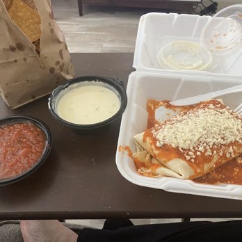 Cantina Louie - To go order: Queso dip, salsa, and burrito supreme with shredded chicken. - Mexican Near Me - St. Augustine, Florida Cantina Louie - To go order: Queso dip, salsa, and burrito supreme with shredded chicken. - Mexican Near Me - St. Augustine, Florida