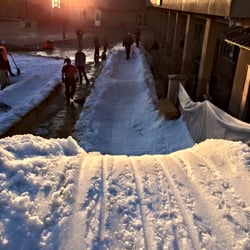Legacy Christian Academy - Top of a sled run on the Legacy campus at the beginning of SNOW DAY. Over 50 tons of snow is brought in for a day of fun!