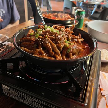 Hanshin Pocha - Their infamous chicken feet dish. It's insanely spicy!! We found whole jelapeno in the sauce. - Korean Near Me - Oakland, California Hanshin Pocha - Their infamous chicken feet dish. It's insanely spicy!! We found whole jelapeno in the sauce. - Korean Near Me - Oakland, California