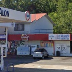 The Sand Bar - A liquor store is located next to the ALON gas station.