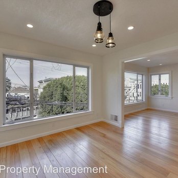ICD Construction - a large empty room with hardwood floors - Kitchen & Bath Near Me - San Francisco, California