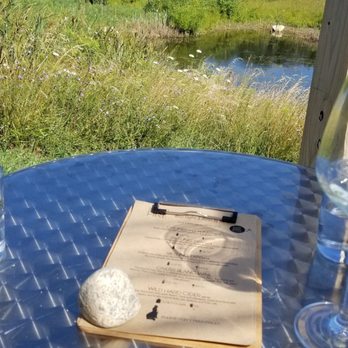 Waterfire Vineyards Torch Lake - Far side patio area (best seat in the house) - Wineries Near Me - Kewadin, Michigan Waterfire Vineyards Torch Lake - Far side patio area (best seat in the house) - Wineries Near Me - Kewadin, Michigan