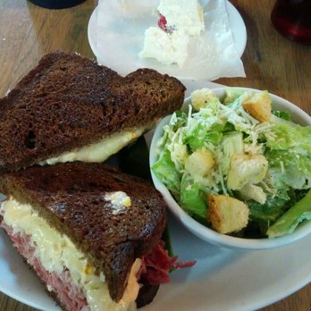 Colossal Cafe - Reuben sandwich with a side of their Cesar salad. - American Near Me - Saint Paul, Minnesota Colossal Cafe - Reuben sandwich with a side of their Cesar salad. - American Near Me - Saint Paul, Minnesota