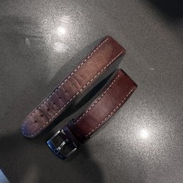 Unrestored & restored leather watch strap with the store owner's product.