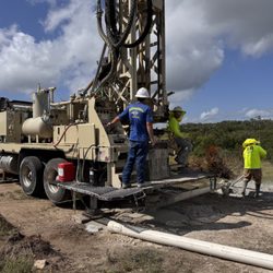 TR Drilling & Service - TR Drilling & Service technicians drilling a hole with equipment