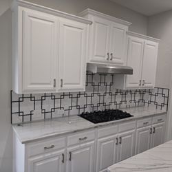Jay the Builder - Kitchen remodel and design with quartzite countertops, marble backsplash, black marble look porcelain tiles.