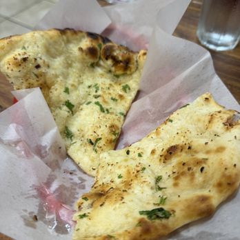 New Kamana Kitchen - Garlic naan (so good we forgot to take a picture first!) - Indian Near Me - Honolulu, Hawaii New Kamana Kitchen - Garlic naan (so good we forgot to take a picture first!) - Indian Near Me - Honolulu, Hawaii