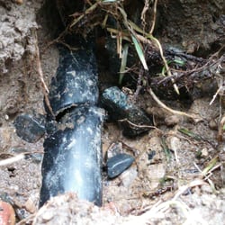 Get Fenced - Sprinkler pipe next to a post was cracked and left unfixed after fence installation. Water leaked causing flood under fence when turned on.