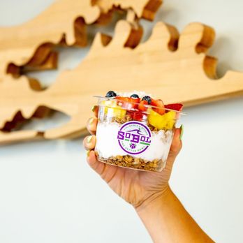 SoBoL - a hand holding a cup of yogurt - Acai Bowls Near Me - Ronkonkoma, New York