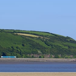 Ferryside Beach - Train leaving Ferryside and bordering the beach