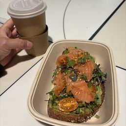 avocado toast with smoked salmon and large drip coffee. avocado toast with smoked salmon and large drip coffee.