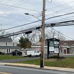 Francis Clark, MD - Exterior signage between two driveways. Enter where the driveway for the car wash is located. Offices are in the rear.