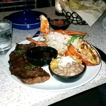 Coasterra - The lobster and  carne asada plate with tortillas and the complimentary chips and salsa in the background - Mexican Near Me - San Diego, California