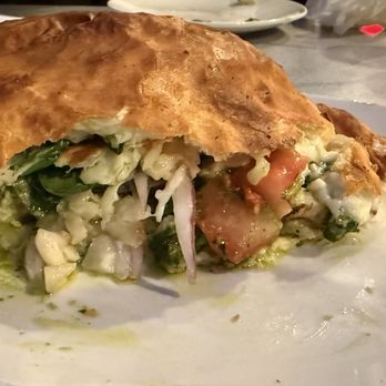 Sella's Calzone & Pizza - Chicken pesto calzone with spinach & onion added - Pizza Near Me - Pullman, Washington Sella's Calzone & Pizza - Chicken pesto calzone with spinach & onion added - Pizza Near Me - Pullman, Washington