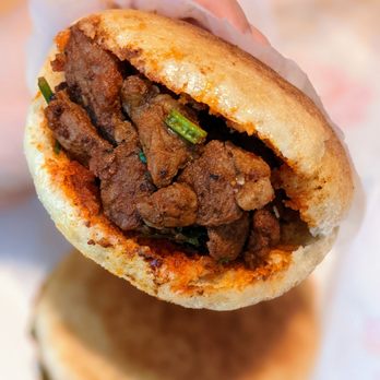 Sister Liu's Kitchen - Spicy Cumin Lamb Burger. $8.95. - Chinese Near Me - Durham, North Carolina Sister Liu's Kitchen - Spicy Cumin Lamb Burger. $8.95. - Chinese Near Me - Durham, North Carolina