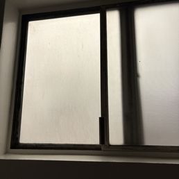Moldy window frame, management kept saying "It's not mold." As if black spores on a white damp window frame isn't mold...