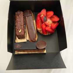Jean Christophe Perrin - Rocher (left), chocolate eclair (middle), strawberry pastry with gold flake (right), chocolate cake (bottom)