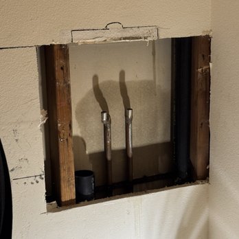 Best Coast Plumbing - Exposed wall after removal of old faucets. - Plumbing Near Me