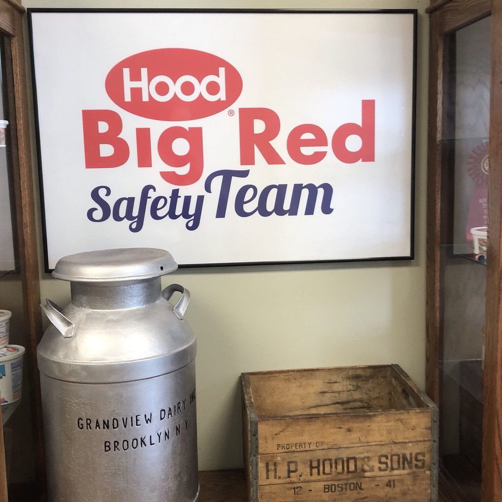 HP Hood - a large metal milk can and a wooden crate - Specialty Food Near Me - Arkport, New York